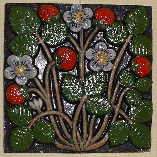 *Lisa Larsson vggtavla i keramik jordgubbar.